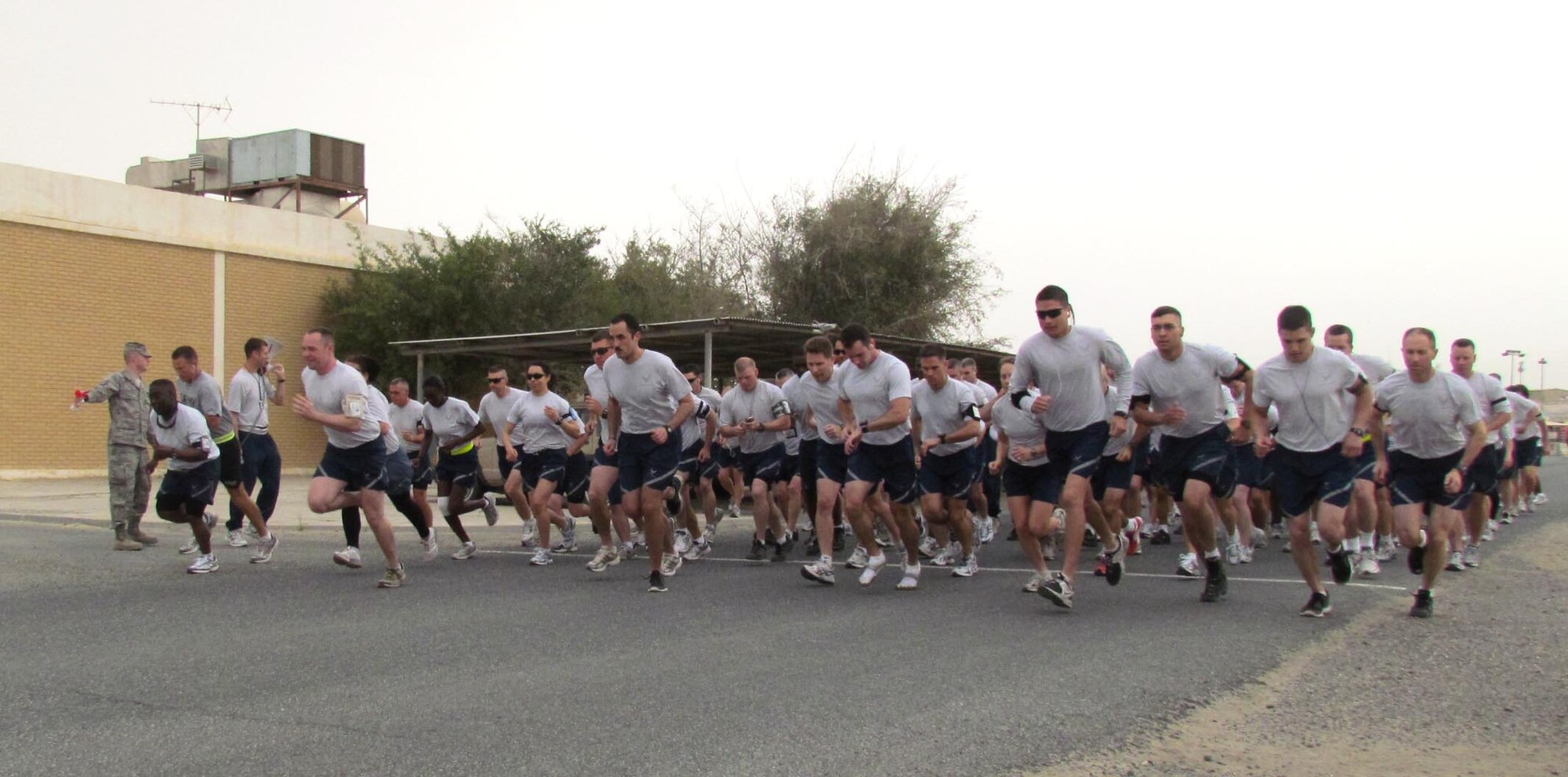 More than 100 members of the 386th Air Expeditionary Wing participated in the Rock Chapel's Physically Fit, Spiritually Strong 5k run April 2, at an undisclosed location in Southwest Asia. (U.S. Air Force photo by Tech. Sgt. Sandra Bradley)                                       