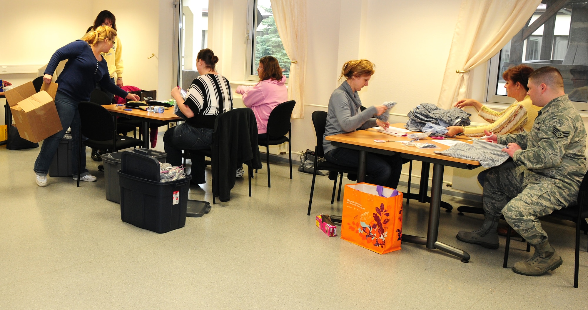 SPANGDAHLEM AIR BASE, Germany — Sew Much Comfort volunteers make modified underwear for wounded warriors at Landstuhl Regional Medical Center in Landstuhl, Germany, March 31 at the Airman and Family Readiness Center here. Sew Much Comfort modifies underwear to be used by wounded warriors with limited mobility. Volunteers have been meeting monthly for more than two years and produce about 150 pairs of modified undergarments annually. (U.S. Air Force Photo/Airman 1st Class Dillon Davis)