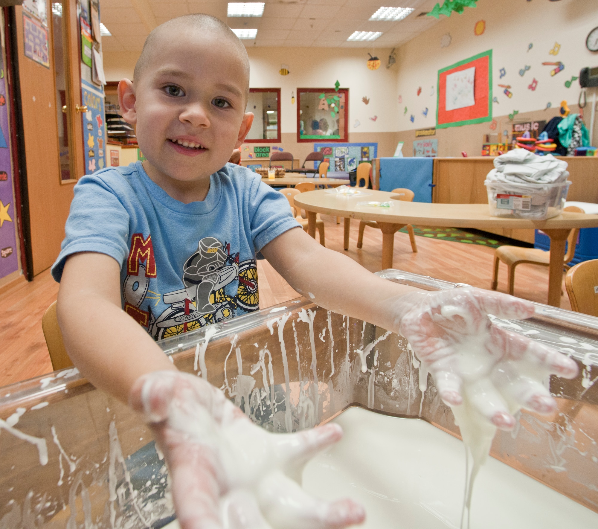Mathew Theissen experiments with corn starch and water during the children’s science fair held at the Child Development Center March 30, 2011, at Incirlik Air Base, Turkey . During the science fair, children and parents participated in hands-on activities designed around scientific principles. The event was held to promote awareness of the CDC’s new accreditation with the National Association for the Education of Young Children. (U.S. Air Force photo by Staff Sgt. Alexandre Montes)
