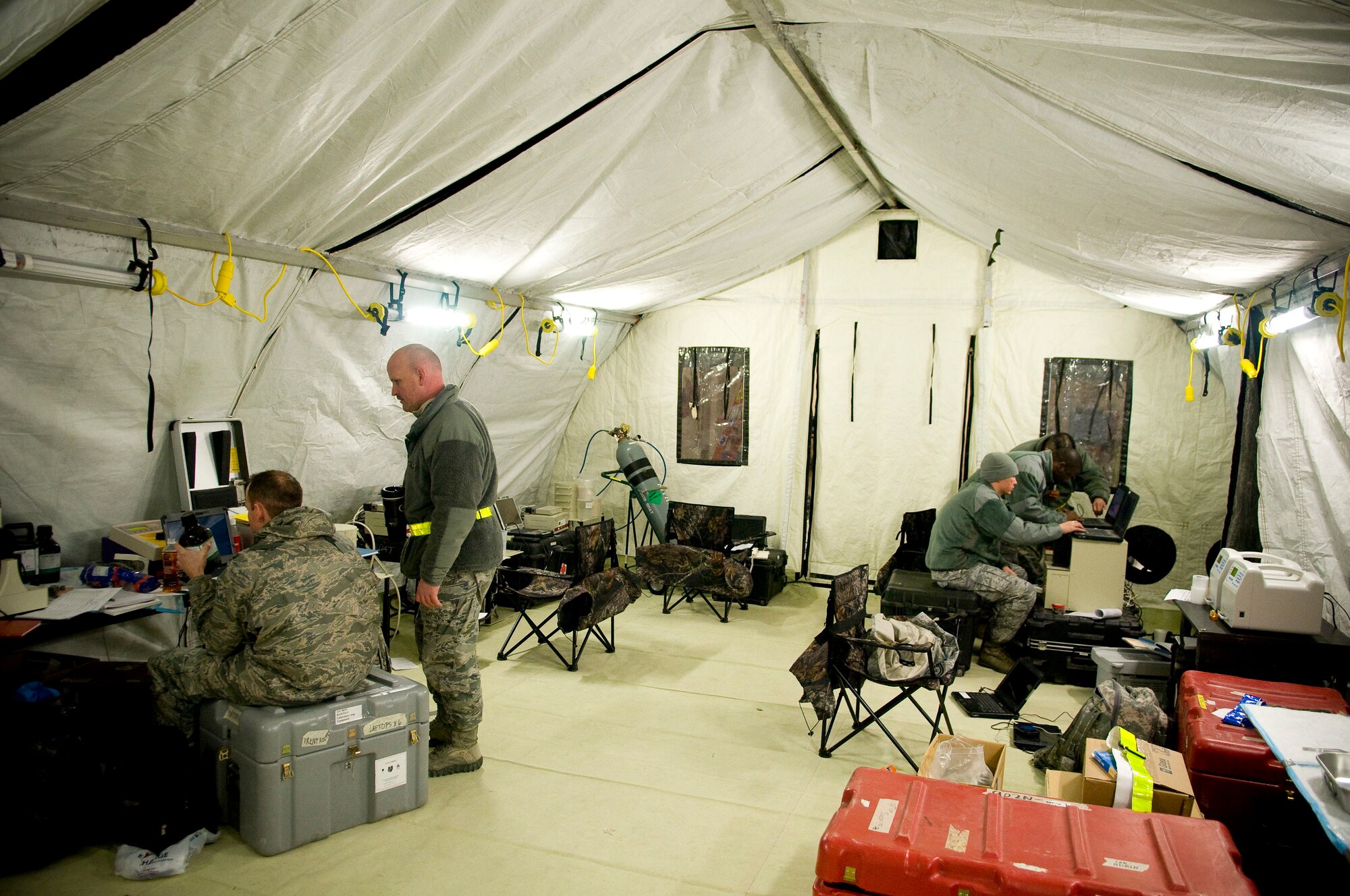 YOKOTA AIR BASE, Japan -- Members of the Air Force Radiation Assessment Team, stationed out of Wright-Patterson Air Force Base, sample tap water from Yokota Air Base's water supply to make sure water at Yokota remains safe to drink March 25. So far there have been no positive findings of any kind in the water. (U.S. Air Force photo/Staff Sgt. Chad C. Strohmeyer)