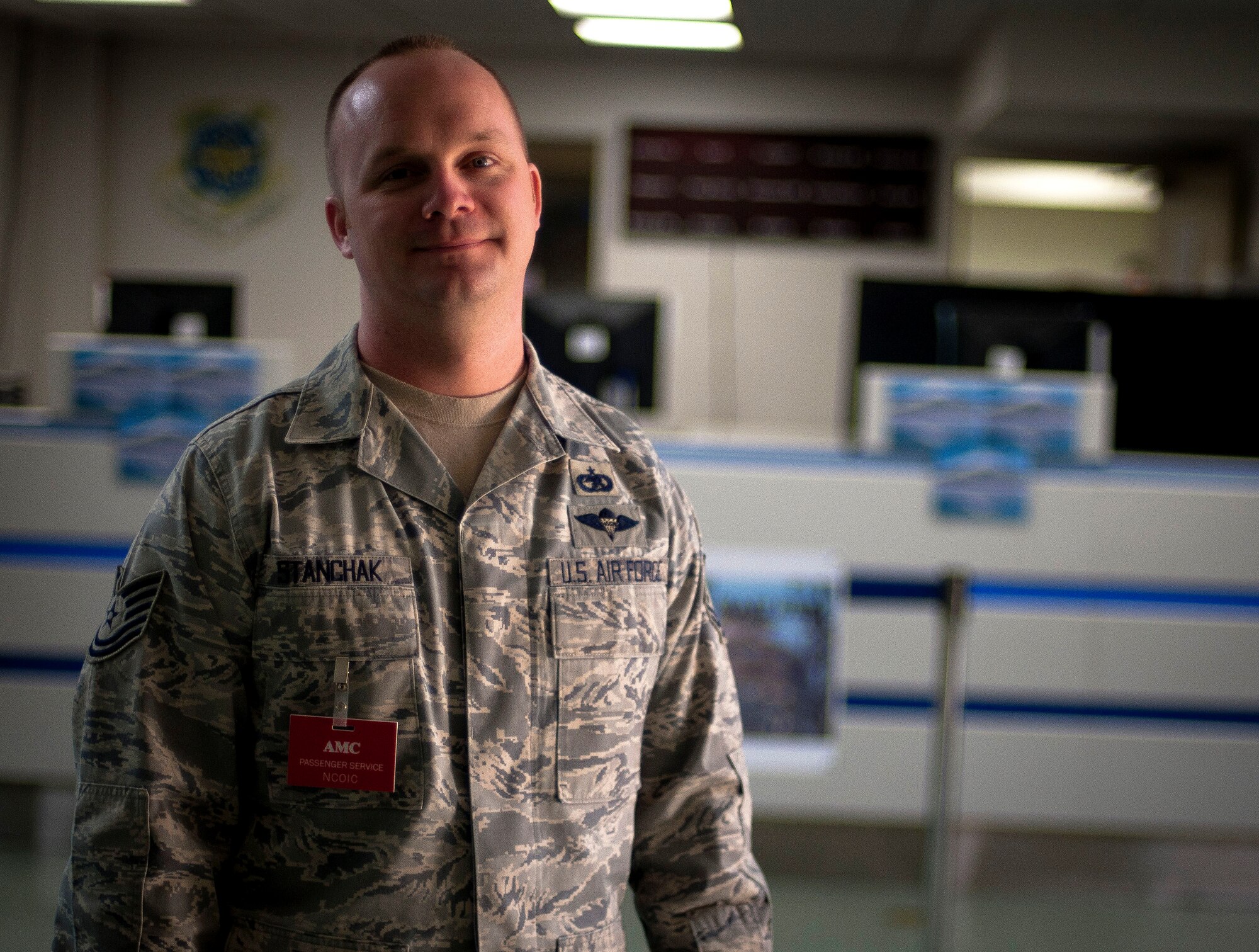 YOKOTA AIR BASE, Japan -- Tech. Sgt. Joseph Stanchak, 730th Air Mobility Squadron passenger operations supervisor, stands in front the the passenger travel customer service counter here April 6. Sergeant Stanchak is a native of Little Rock, Ark. (U.S. Air Force photo/Staff Sgt. Chad C. Strohmeyer)