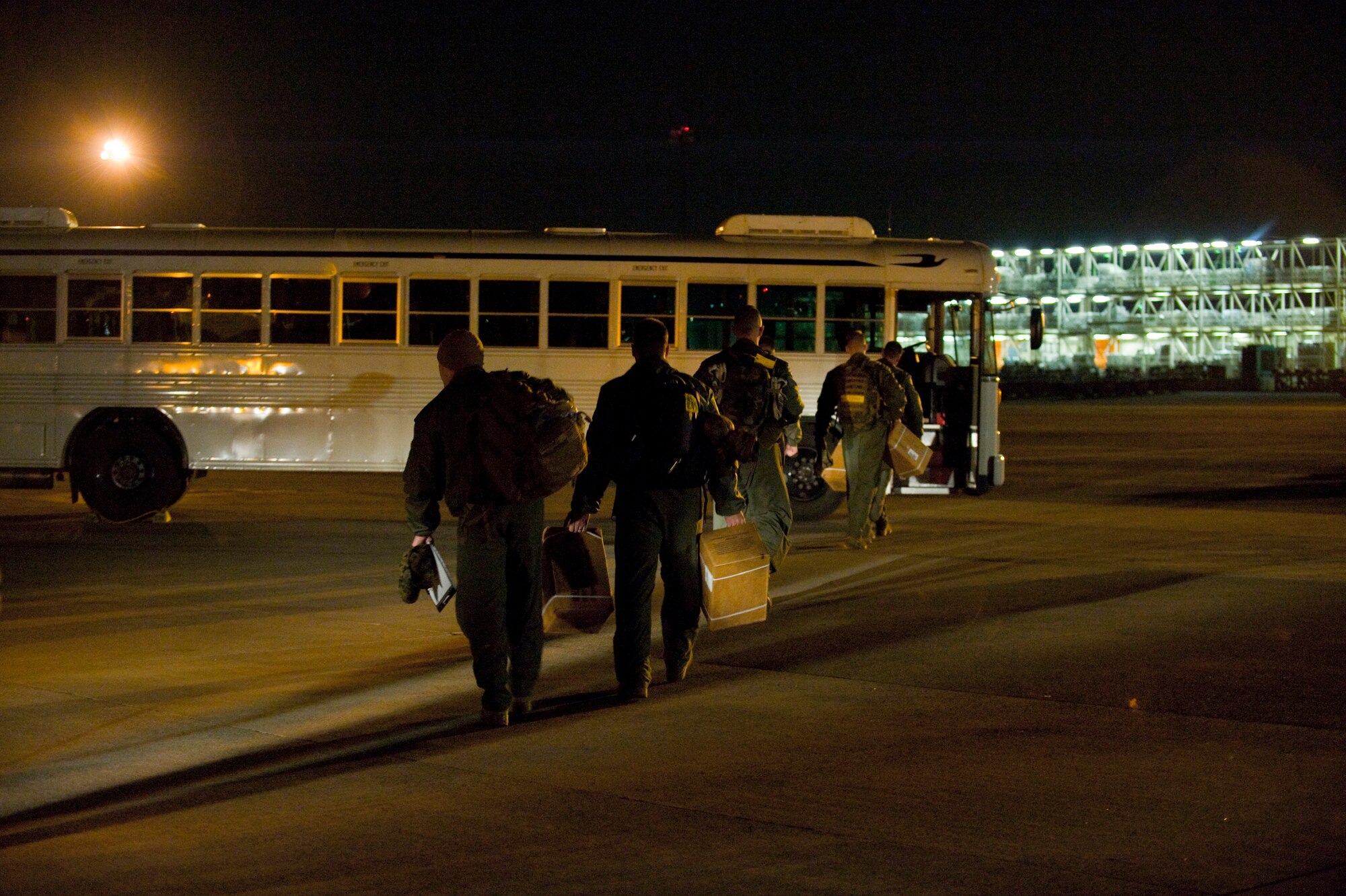 YOKOTA AIR BASE, Japan - Marines from the initial response force board a bus April 3 after arriving at Yokota Air Base. The INF is a 155-person team comprised of Marines from the Naval Support Facility, Indian Head, Md. As a smaller element of the chemical, biological and incident response force, the IRF is specifically trained in the areas of chemical, biological, radiological, nuclear and high yield explosion operations. The CBIRF will support Operation Tomodachi by providing a rapid response capability, and if requested, can assist and advise Japanese authorities. (U.S. Air Force photo/Master Sgt. Jeromy K. Cross)