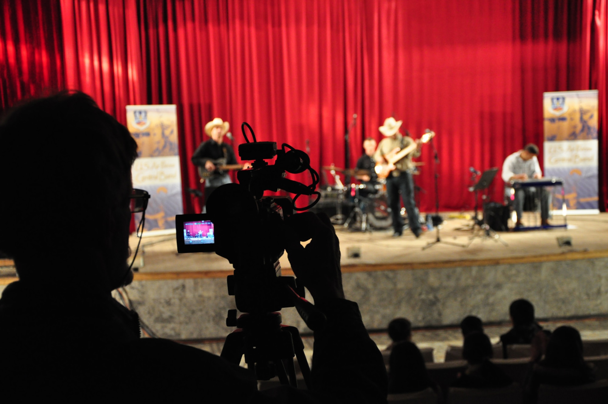 The view from a video camera of a Wild Blue Country performance at the House of Culture in Kant April 5. Wild Blue Country, the current AFCENT band deployed to the Central Command Area of Responsibility, is currently on tour in the Republic of Kyrgyzstan. The band hails from Peterson Air Force Base, Colorado Springs, Colo. (U.S. Air Force photo/Master Sgt. Daniel Nathaniel)