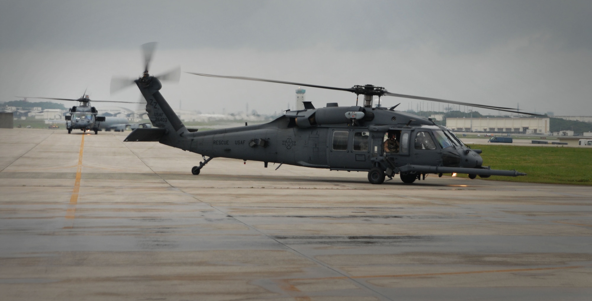 Two HH-60G Pave Hawk’s from the 33rd Rescue Squadron taxi down the runway after returning home here April 4. The two helicopters were part of a five aircraft and five team crew that deployed to mainland Japan for nearly a month in support of Operation Tomodachi. (U.S. Air Force photo by Senior Airman Sara Csurilla)