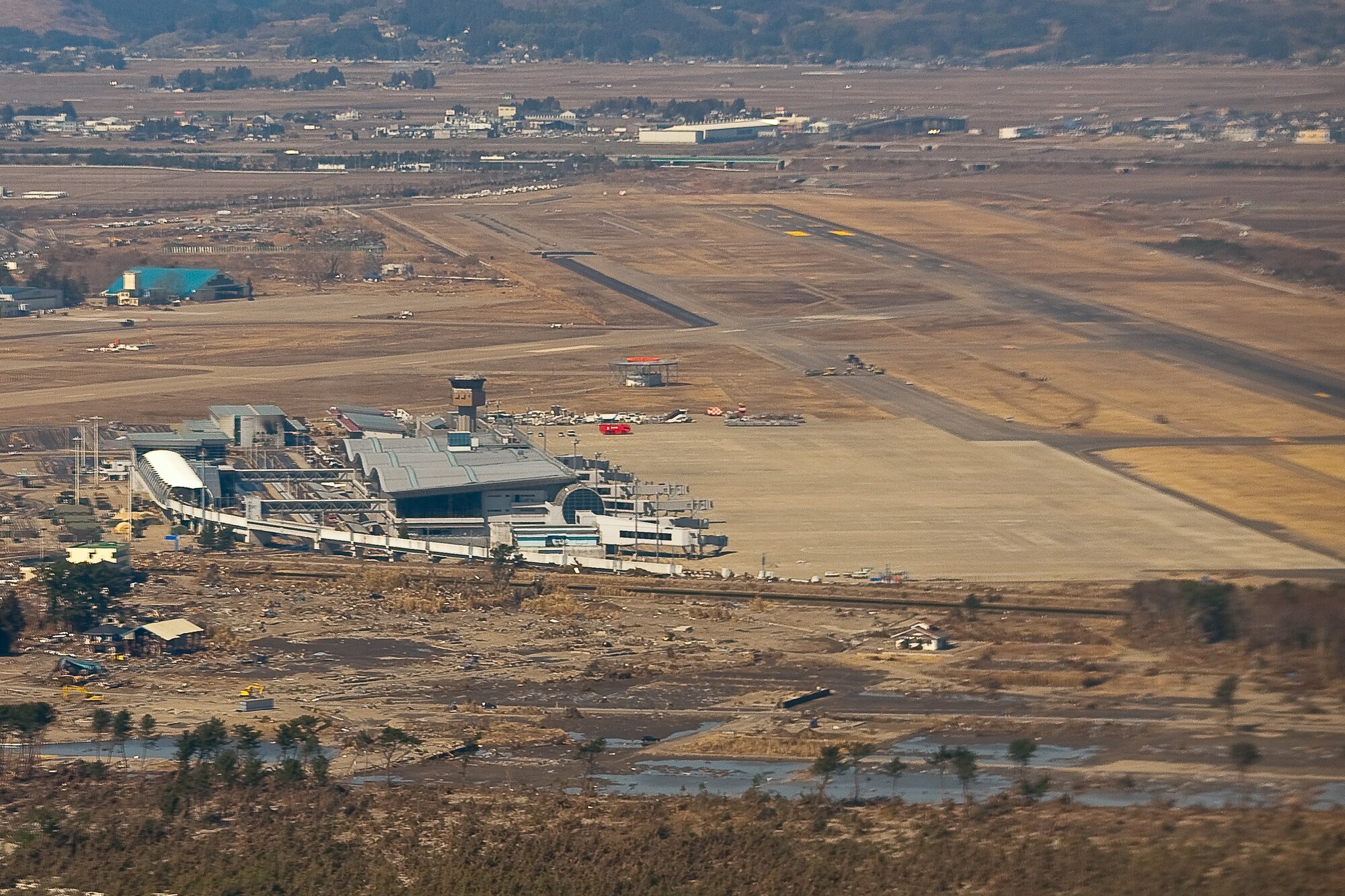 SENDAI AIRPORT, Japan -- Damaged in the March 11 earthquake and resulting tsunami, Sendai Airport reopened to military fixed-wing aircraft March 16 thanks to the efforts of Japanese civilians, Japan Self-Defense Force members and U.S. military members. Since then, the airport has become a logistics hub for relief and recovery efforts. Japanese authorities plan to reopen the airport to commercial traffic in the future. (U.S. Air Force photo/Osakabe Yasuo)