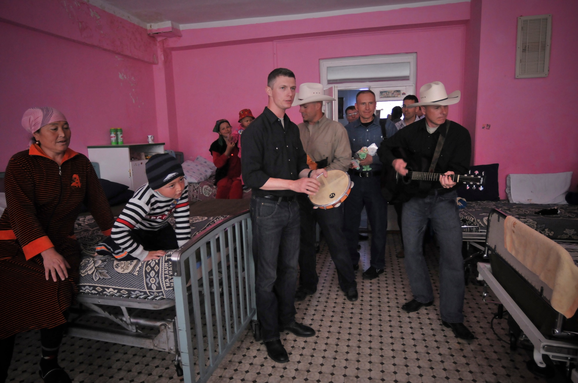 BISHKEK, Kyrgyzstan -  The AFCENT band "Wild Blue Country" visits the Children's Cancer Center in Bishkek to perform for the staff, parents and children there, on April 3.  Band members and members from the Transit Center at Manas played with and gave out gifts to the children.  (U.S. Air Force photo/Staff Sgt. Stacy Moless)

