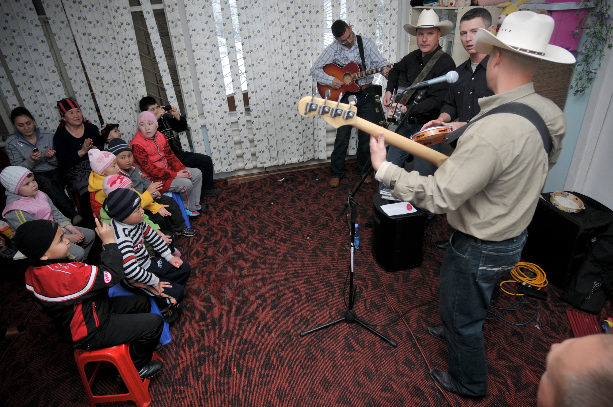 BISHKEK, Kyrgyzstan -  The AFCENT band "Wild Blue Country" visits the Children's Cancer Center in Bishkek to perform for the staff, parents and children there, on April 3.  Band members and members from the Transit Center at Manas played with and gave out gifts to the children.  (U.S. Air Force photo/Staff Sgt. Stacy Moless)

