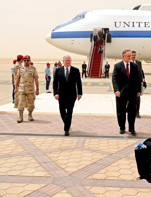 U.S. Defense Secretary Robert M. Gates walks with U.S. Ambassador to Saudi Arabia James Smith after arriving at King Khalid International Airport in Riyadh, Saudi Arabia, April 6, 2011.