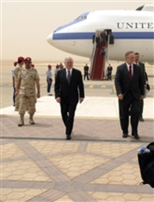 Secretary of Defense Robert M. Gates walks with U.S. Ambassador to Saudi Arabia James Smith after arriving at King Khalid International Airport in Riyadh, Kingdom of Saudi Arabia, on April 6, 2011.  