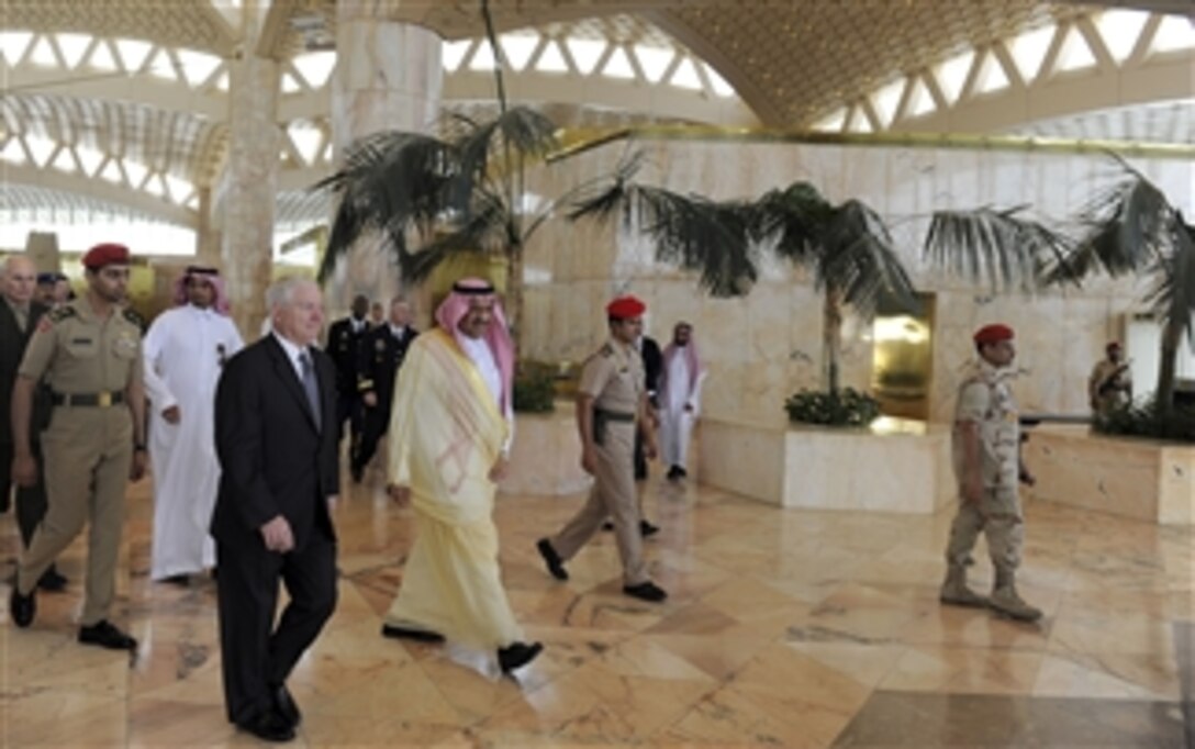 Secretary of Defense Robert M. Gates walks with Saudi Arabian Prince Khalid bin Sultan after arriving at King Khalid International Airport in Riyadh, Kingdom of Saudi Arabia, on Apr. 6, 2011.  