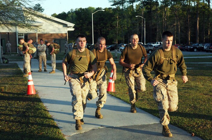 A team of Marines from Combat Logistics Battalion 6, Combat Logistics Regiment 2, 2nd Marine Logistics Group, begin a warrior physical training event aboard Camp Lejeune, N.C., April 7, 2011. The nine-mile event consisted of a run that began at the CLR-2 headquarters building to the Endurance Course at the Battle Skills Training School and back to headquarters. (U.S. Marine Corps photo by Pfc. Franklin E. Mercado)