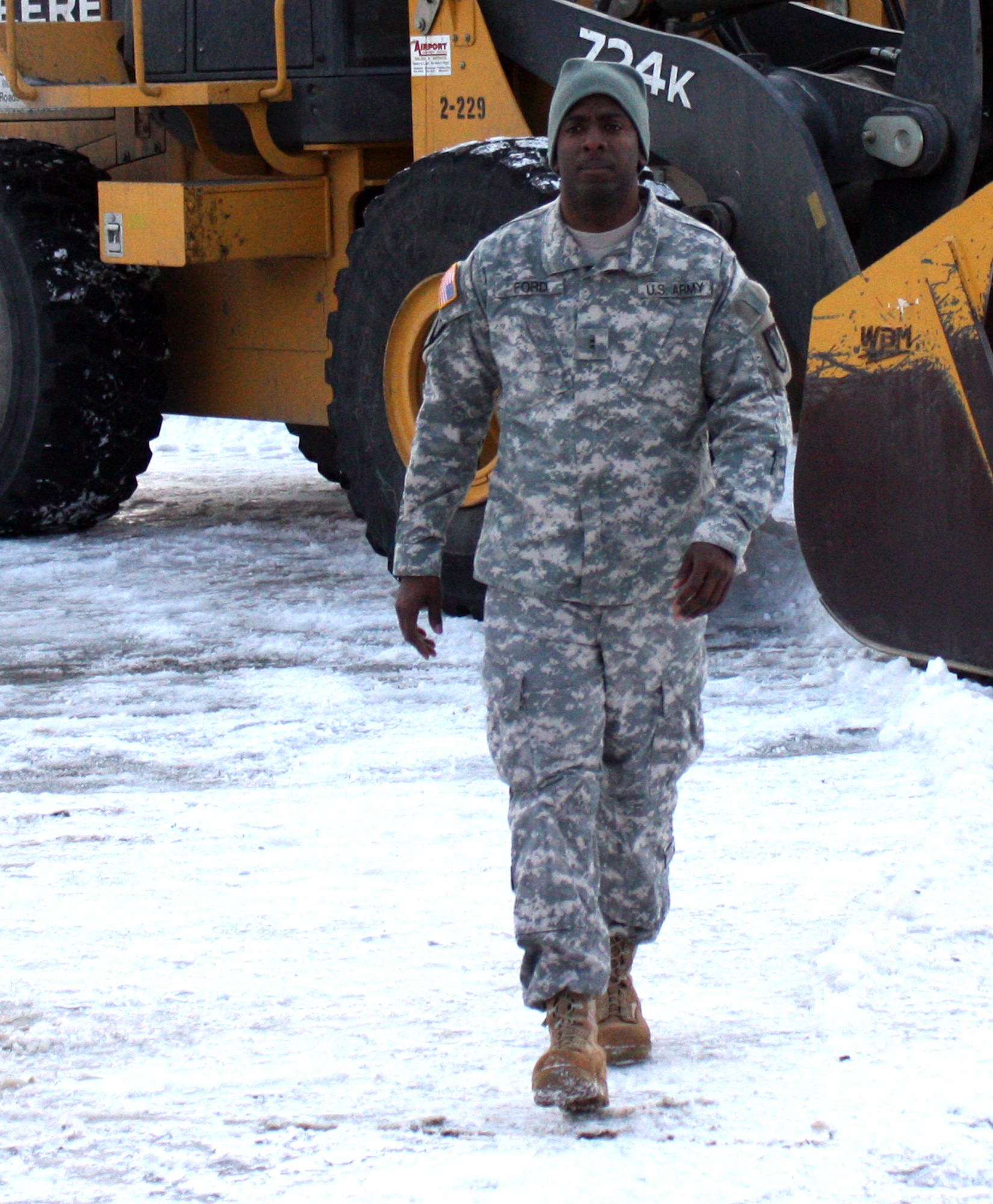 JOINT BASE ELMENDORF-RICHARDSON, Alaska ? Chief Warrant Officer Lanorris Ford, battalion maintenance officer for the 793rd Military Police Battalion, walks through the battalion?s motor pool here Wednesday. Ford was the only active duty Army warrant officer to win this year?s MacArthur Leadership Award and one of two MacArthur awardees from the Alaska-based 3rd Maneuver Enhancement Brigade. (U.S. Army photo by Staff Sgt. Jason Epperson/Released)
