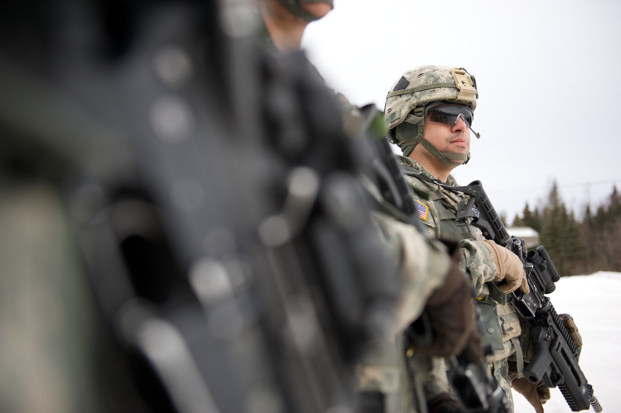 JOINT BASE ELMENDORF-RICHARDSON, Alaska ? Spc. Oscar Shiebeck, A Company, 1st Battalion, 501st Infantry Regiment (Airborne), prepares mentally, March 24, for the company's stress shoot at the Joint Base Elmendorf-Richardson range. (U.S. Air Force photo by David Bedard/Released)
