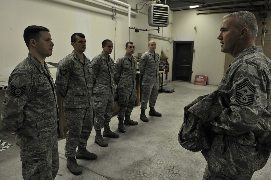 Chief Master Sgt. Brooke McLean speaks with Airmen assigned to the 354th Maintenance Squadron about the units mission and the harsh weather conditions during a tour of Eielson Air Force Base, Alaska, Feb. 15. 2011. Chief McLean is the Pacific Air Forces Command Chief. (U.S. Air Force photo/Staff Sgt. Christopher Boitz)
