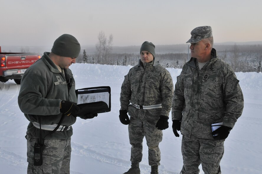 Chief Master Sgt. Brooke McLean receives a safety brief from Staff Sgt. Benjamin Amen before entering a munitions storage area Feb. 15, 2011, Eielson Air Force Base, Alaska. Chief McLean is the Pacific Air Forces Command Chief and Sergeant Amen is assigned to the 354th Maintenance Squadron. (U.S. Air Force photo/Staff Sgt. Christopher Boitz)  