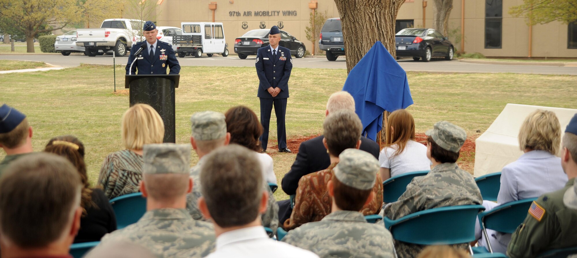 ALTUS AIR FORCE BASE, Okla. – Col. Jon T. Thomas, 97th Air Mobility Wing commander, officially dedicates an area within the Wings of Freedom Park April 7 as Combat Airmen’s Grove. The area, which includes several trees and a bench donated by the Altus Military Affairs Committee, is dedicated to the Airmen of the Mighty 97th who have died in a combat zone in service to the nation. Staff Sgt. Andrew S. Bubacz was the first and only Altus Airman to date to die while supporting Operation Enduring Freedom; his name is engraved on the granite bench in honor of his sacrifice. (U.S. Air Force photo by Airman 1st Class Myles Stepp / Release 97th Air Mobility Wing Public Affairs)
