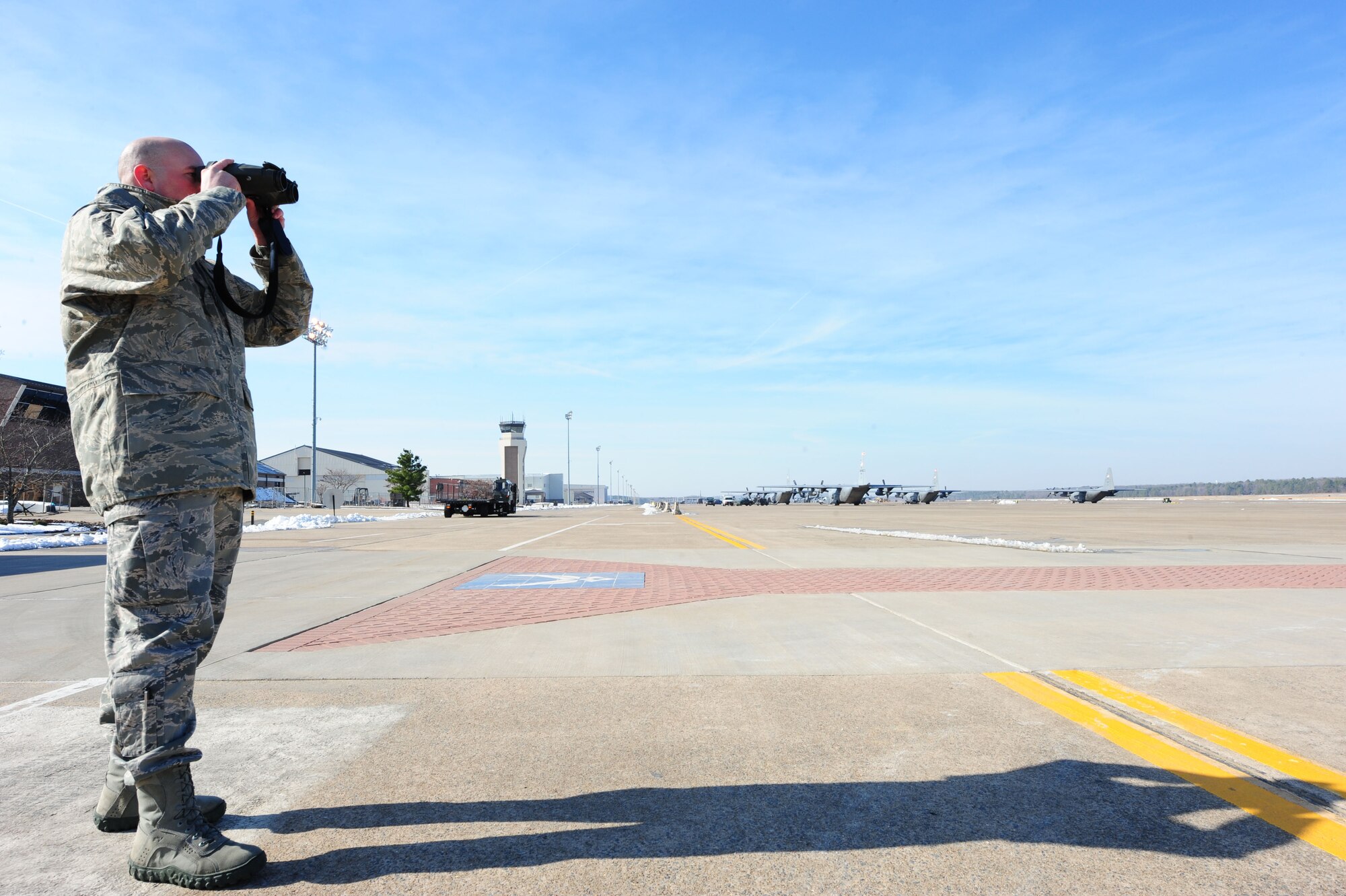 Staff Sgt. Michael Winders, a 19th Operations Support Squadron weather technician, operates a laser range finder Jan. 15, 2011, at Little Rock Air Force Base, Ark. The laser range finder determines the distances of objects and direction from zero to 360 degrees to help develop an accurate forecast for aircrew members. (U.S. Air Force photo by Senior Airman Jim Araos)