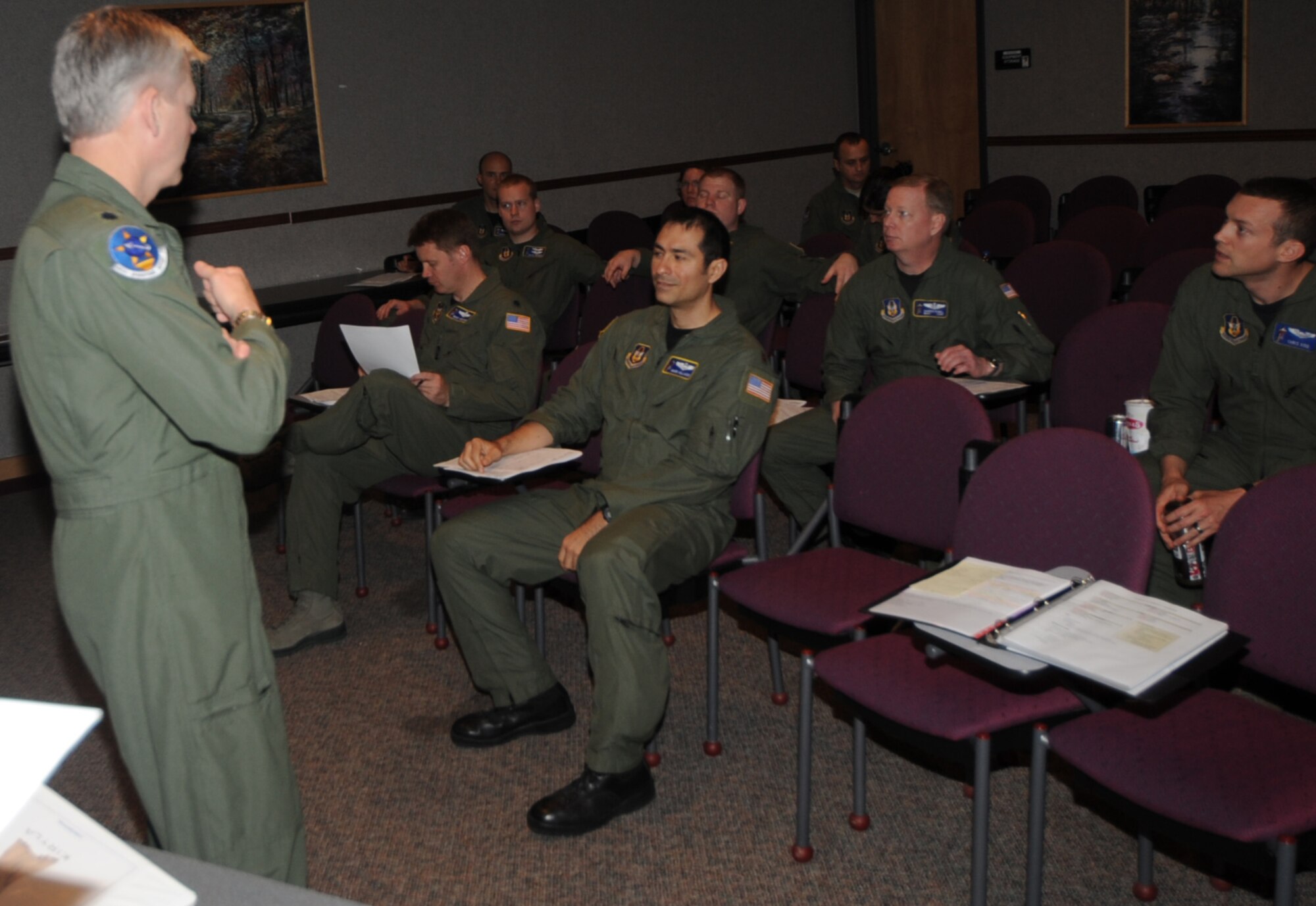 Lt. Col. Barry Jones, 931st Operations Support Squadron Commander briefs aircrews in preparation for their deployment to provide aerial refueling to NATO aircraft in support of Operation Odyssey Dawn, March 21. (Air Force photo by Capt. Tim Wade)
