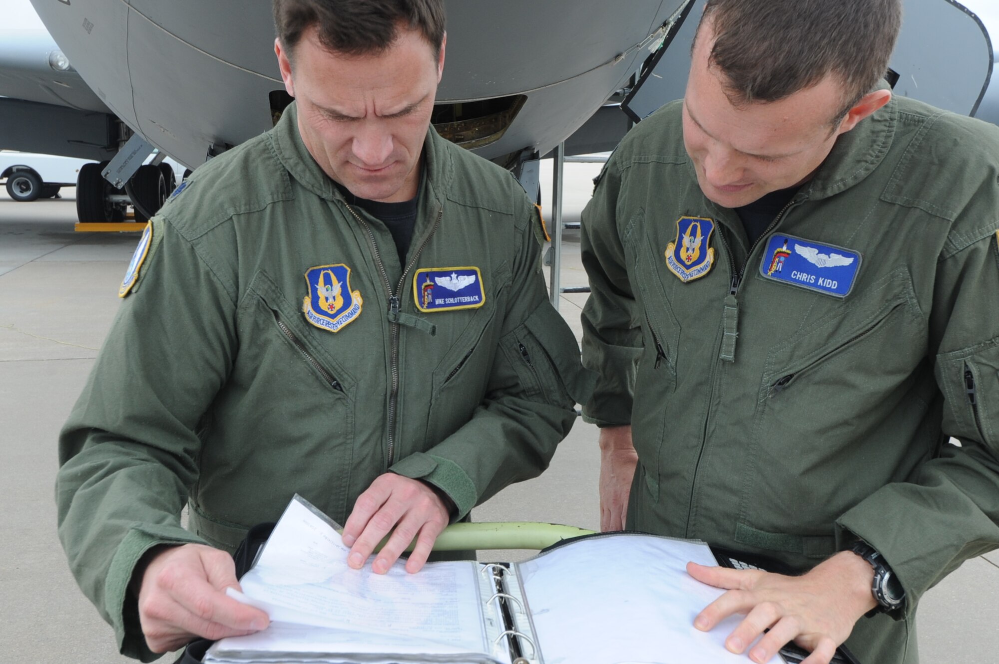 Lt. Col. Michael Schlotterback and Capt. Chris Kidd of the 18th ARS, 931st ARG review the flight checklist prior to deploying in support of Operation Odyssey Dawn, March 21. The 931st Airmen were the first AFRC refueling unit to arrive in support of the NATO operation. (Air Force photo by Capt. Tim Wade)