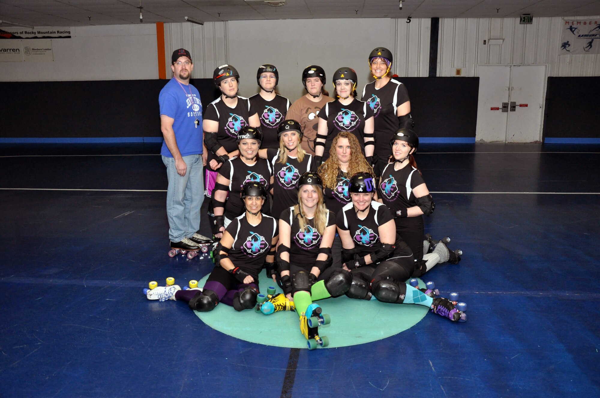 Master Sgt. Jessica Fehsal, 90th Maintenance Operations Squadron, poses with members of her team, the Cheyenne Prairie Fire Roller Girls, before a practice session March 10. (U.S. Air Force photo by Airman 1st Class Dan Gage)