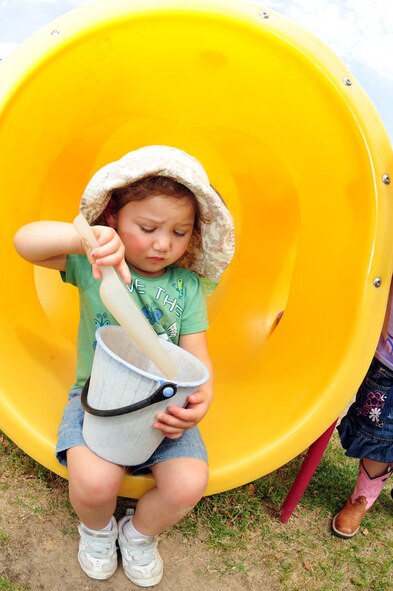 Samantha Inovejas, 2, plays with a shovel and bucket of sand during play time at the child development center located on Barksdale Air Force Base, La., April 7. Samantha and her classmates wore hats all day as part of Month of the Military Child. Events will continue through the end of April culminating with a parade for the children on April 29. Samantha is the daughter of Tech. Sgt. Lance Inovejas, 2nd Communications Squadron, and Tech. Sgt. Deborah Inovejas, 2nd Maintenance Operations Squadron. (U.S. Air Force photo/Senior Airman Joanna M. Kresge)