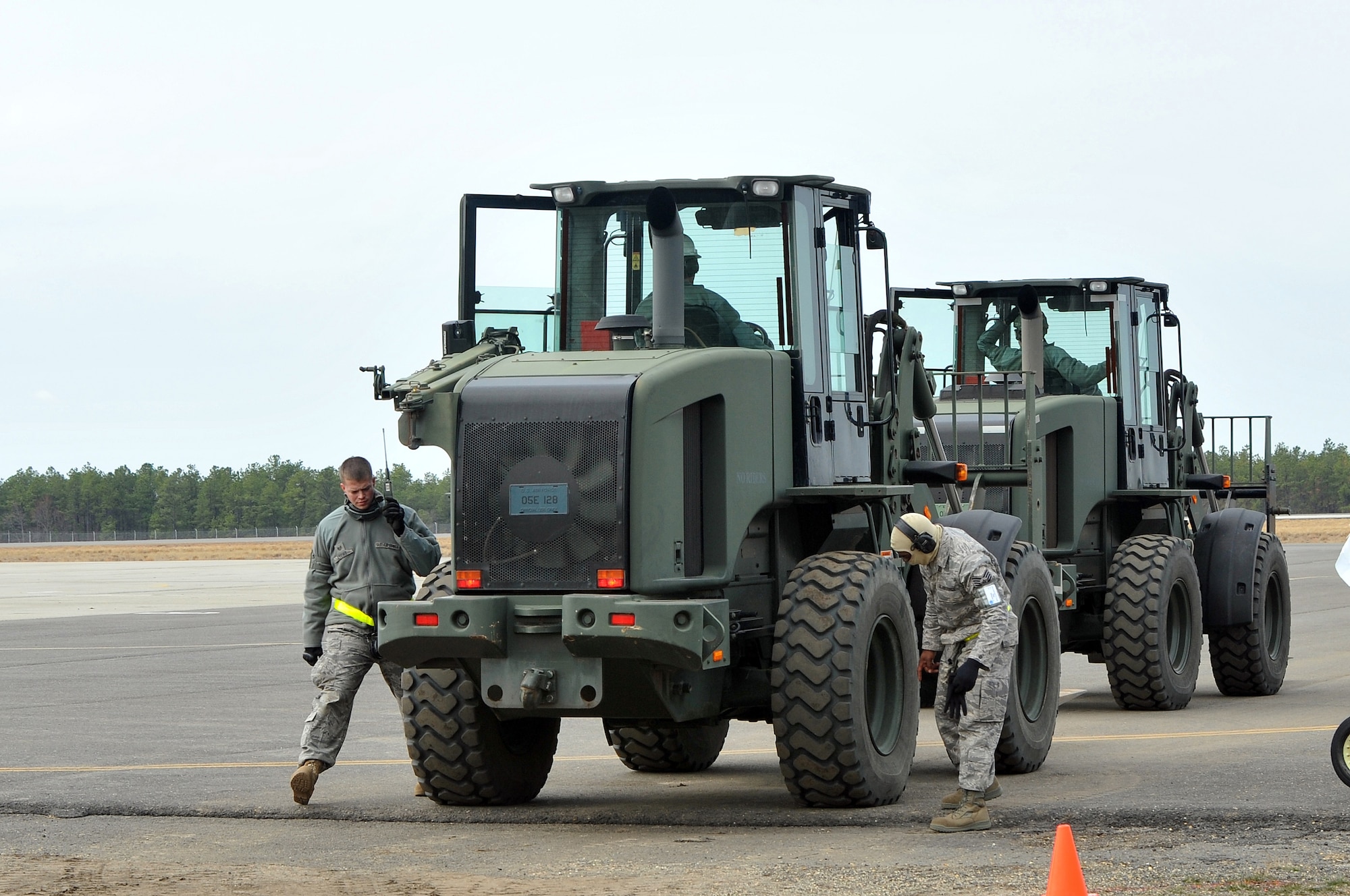 JOINT BASE MCGUIRE-DIX-LAKEHURST, N.J. -- Aerial Porters of the 570th Contingency Response Group perform a foreign-object-debris check on their vehicles before driving onto the flight line during EAGLE FLAG April 4. The Air Force, 570th Contingency Response Group, Travis Air Force Base, Calif., and the Army, 689th Rapid Port Opening Element, Joint Base Langley-Eustis, Va., worked together to build a bare base for humanitarian relief efforts during EAGLE FLAG conducted by the U.S. Air Force Expeditionary Center. (U.S. Air Force photo by Wayne Russell/Released)