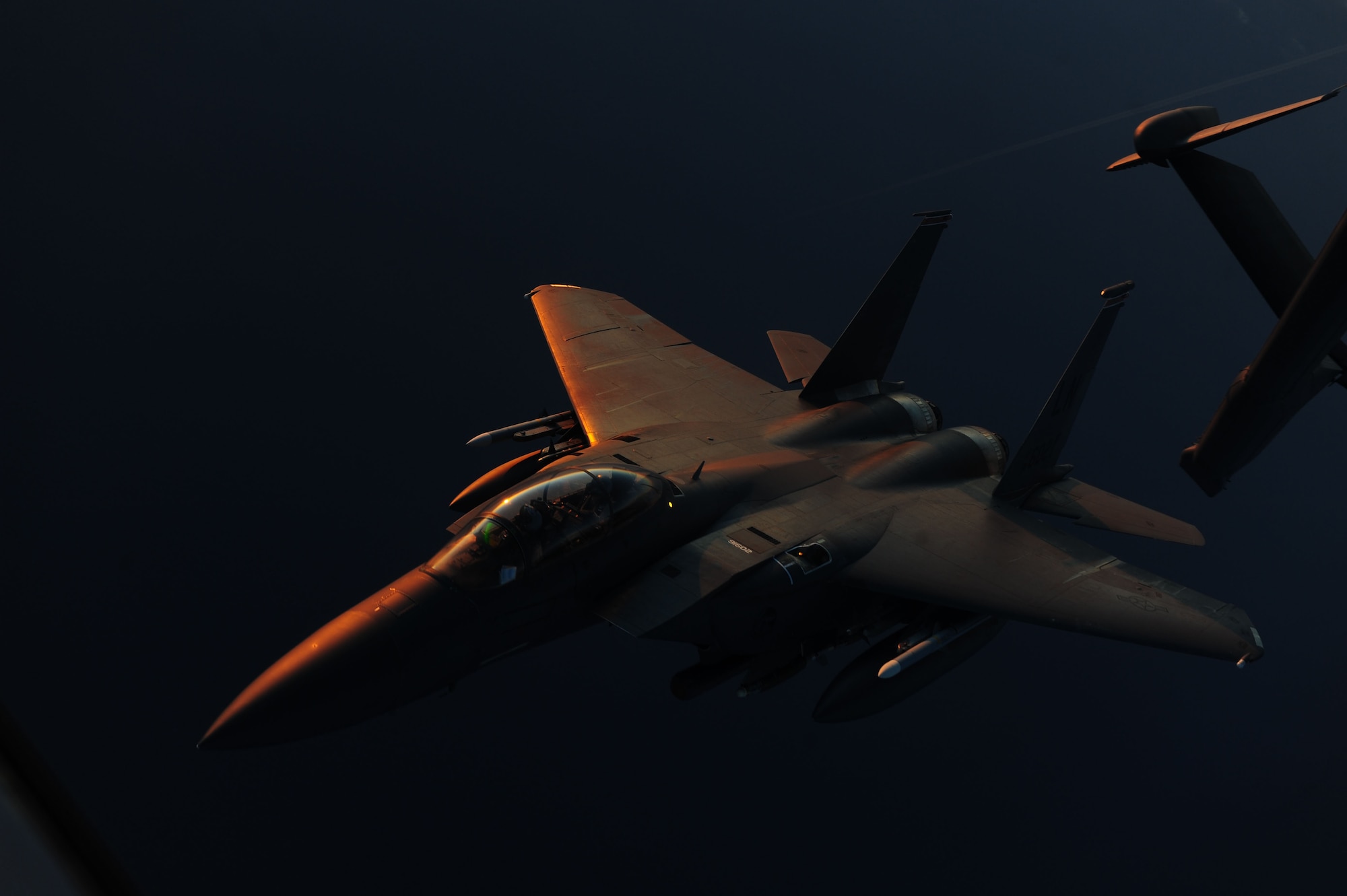 A U.S. Air Force KC-10A Extender aircraft assigned to the 2nd Air Refueling Squadron, Joint Base McGuire-Dix-Lakehurst, N.J., refuels an F-15E Strike Eagle fighter jet March 29, 2011, during Operation Odyssey Dawn operations near Western Europe. Joint Task Force Odyssey Dawn was a U.S. Africa Command task force established to provide operational and tactical command and control of U.S. military forces supporting the international response to the unrest in Libya and enforcement of United Nations Security Council Resolution (UNSCR) 1973. UNSCR 1973 authorized all necessary measures to protect civilians in Libya under threat of attack by forces of Col. Moammar Gadhafi's regime. (U.S. Air Force photo by Senior Airman Tyler Placie) 