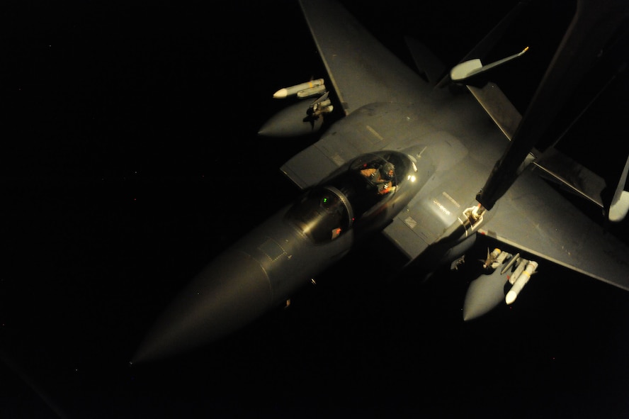 A U.S. Air Force KC-10A Extender aircraft assigned to the 2nd Air Refueling Squadron, Joint Base McGuire-Dix-Lakehurst, N.J., refuels an F-15E Strike Eagle fighter jet March 29, 2011, during Operation Odyssey Dawn. Joint Task Force Odyssey Dawn was a U.S. Africa Command task force established to provide operational and tactical command and control of U.S. military forces supporting the international response to the unrest in Libya and enforcement of United Nations Security Council Resolution (UNSCR) 1973. UNSCR 1973 authorized all necessary measures to protect civilians in Libya under threat of attack by forces of Col. Moammar Gadhafi's regime. (U.S. Air Force photo by Senior Airman Tyler Placie) 