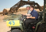 A.J. Allmendinger, NASCAR driver for the Air Force-sponsored No. 43 car, and Master Sgt. Charles Davidson, 319th Training Squadron, take a gator for a spin at the Basic Expeditionary Airman Skills Training course April 6. Mr. Allmendinger spent the day touring Randolph and Lackland. (U.S. Air Force photo/Robbin Cresswell)