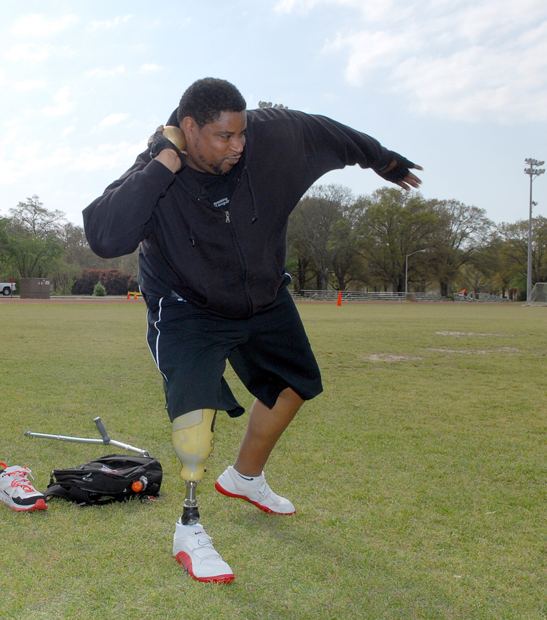Timothy Anderson practices throwing the shotput. U. S. Air Force photo by Tommie Horton