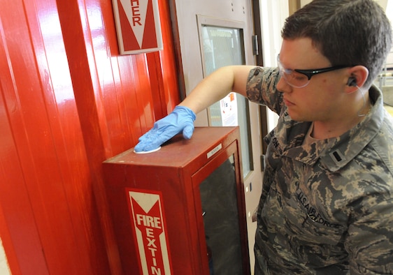 First Lt. Eric Bacon, a 78th Aerospace Medicine Squadron bioenvironmental engineer, conducts swipe sampling on the flightline. U. S. Air Force photo by Raymond Crayton, Jr.