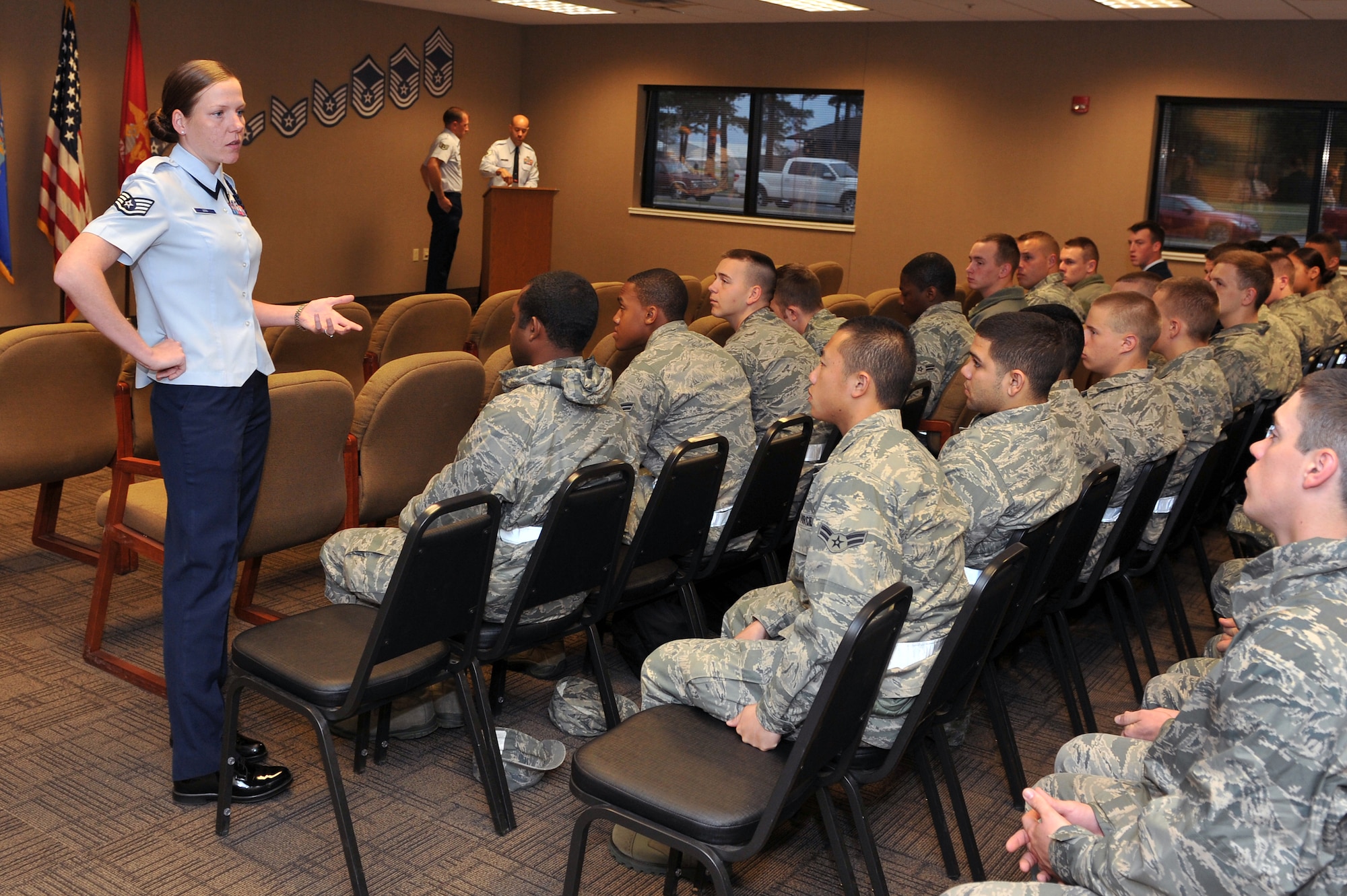 Staff Sgt. Laura Winn, a 373rd Training Squadron military training leader, addresses the current class of students in training at the 373rd TRS March 28, 2011, at Little Rock Air Force Base, Ark. The Magee, Miss., native co-leads 18 dorm programs and is president of the 19th Airlift Wing Airman Against Drunk Driving program. (U.S. Air Force photo/Staff Sgt. Chris Willis)