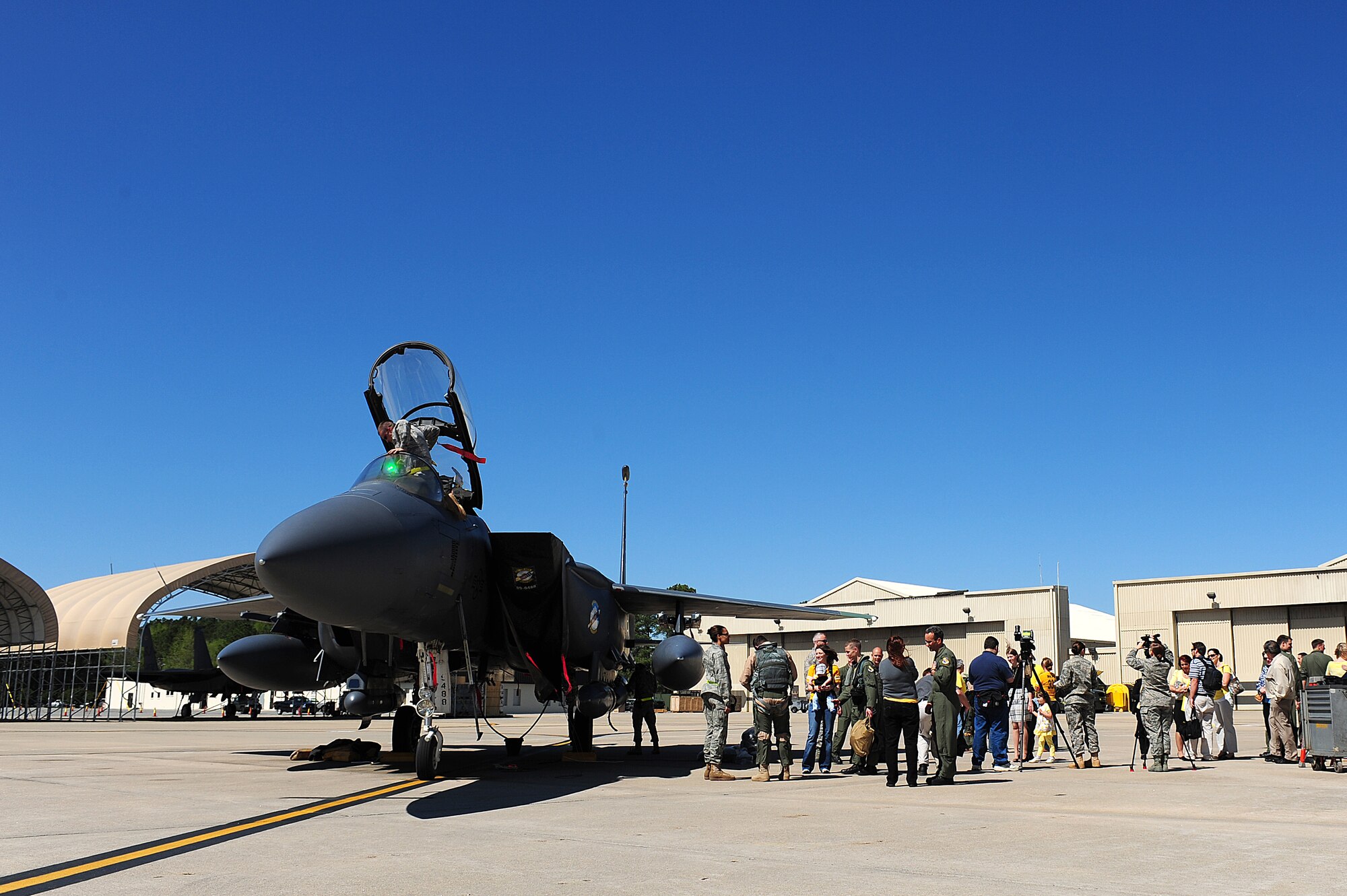 SEYMOUR JOHNSON AIR FORCE BASE, N.C. -- Friends, family, co-workers and reporters gather around returning 336th Fighter Squadron pilots and weapon systems officers here after a seven-month deployment to Afghanistan. (U.S. Air Force photo/Senior Airman Rae Perry) (RELEASED)