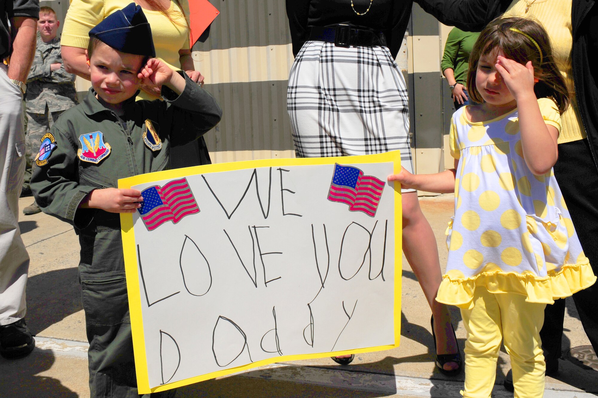 SEYMOUR JOHNSON AIR FORCE BASE, N.C. -- Steven and Alyssa Bruggeman await their father's return with the final four-ship of F-15E Strike Eagles from the 336th Fighter Squadron here April 6, 2011. Their father is Maj. Kurt Bruggeman, a pilot with the 336th FS, who returned after a seven-month deployment to Bagram Airfield, Afghanistan. (U.S. Air Force photo/Senior Airman Rae Perry) (RELEASED)