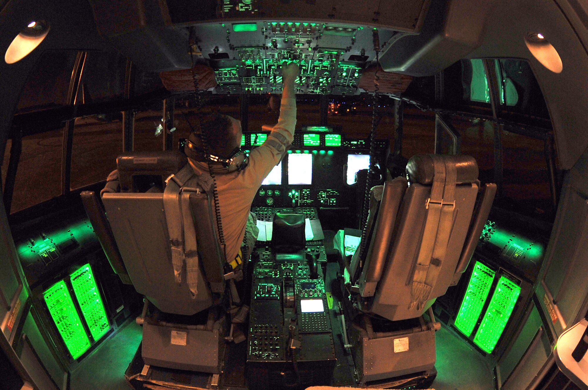 Staff Sgt. Troy Miller checks fuel tank levels from the flight deck of a C-130 Hercules March 24, 2011, at Little Rock Air Force Base, Ark. Sergeant Miller is a panel operator assigned to the 19th Component Maintenance Squadron. (U.S. Air Force photo/Staff Sgt. Chris Willis)