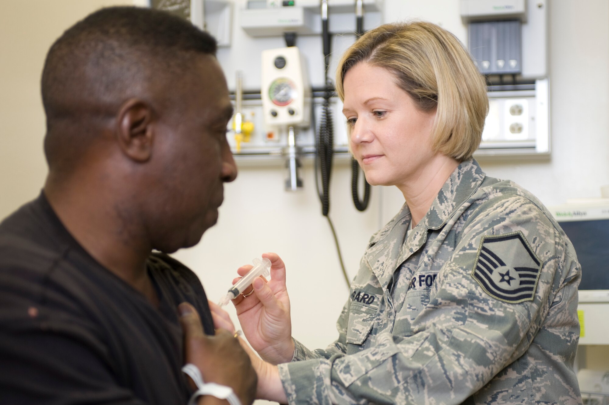 Master Sgt. Tanya Hubbard, flight chief for the emergency department of the 60th Medical Operations Squadron, works with a patient at Travis Air Force Base, Calif., in 2010. On April 1, 2011, Sergeant Hubbard was named the 2010 Air Mobility Command NCO of the Year. (U.S. Air Force Photo)

