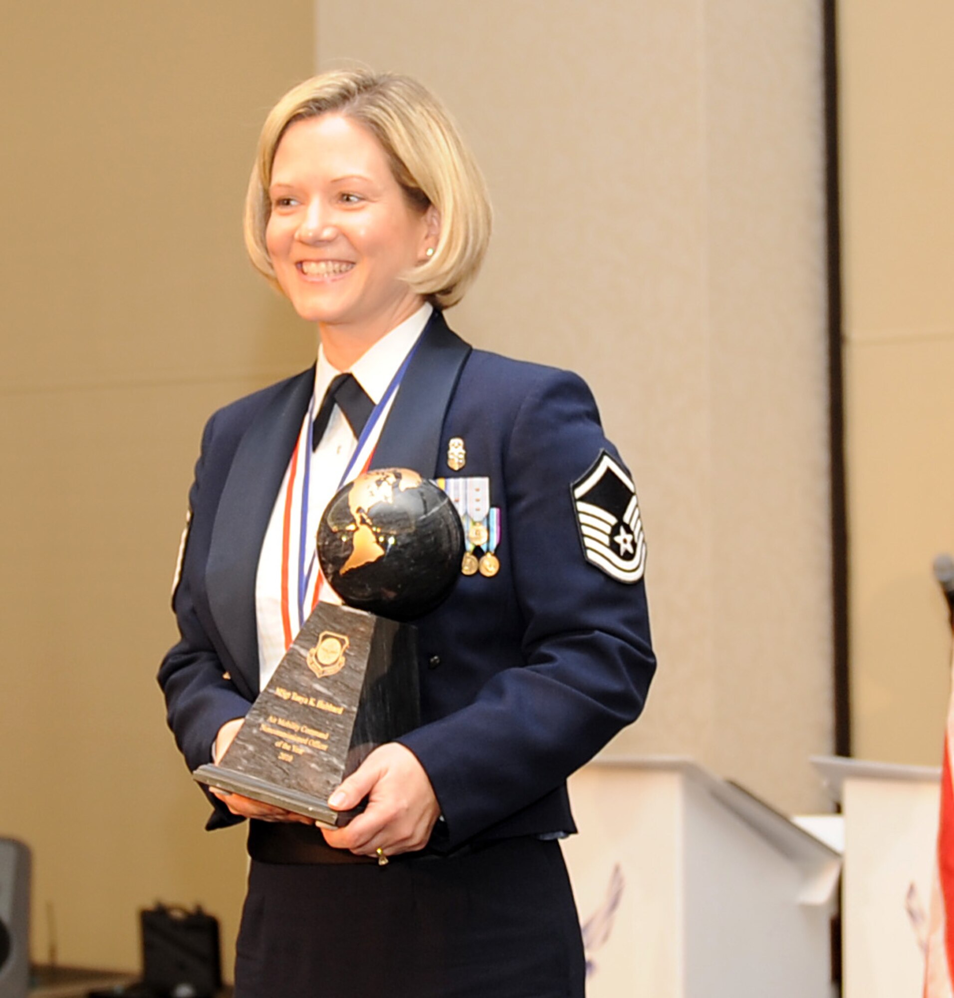 Master Sgt. Tanya Hubbard, from the 60th Medical Operations Squadron at Travis Air Force Base, Calif., holds her award after being named the 2010 Air Mobility Command NCO of the Year during AMC's Outstanding Airmen of the Year banquet April 1, 2011, at Scott Air Force Base, Ill. (U.S. Air Force Photo/Airman 1st Class Divine Cox)
