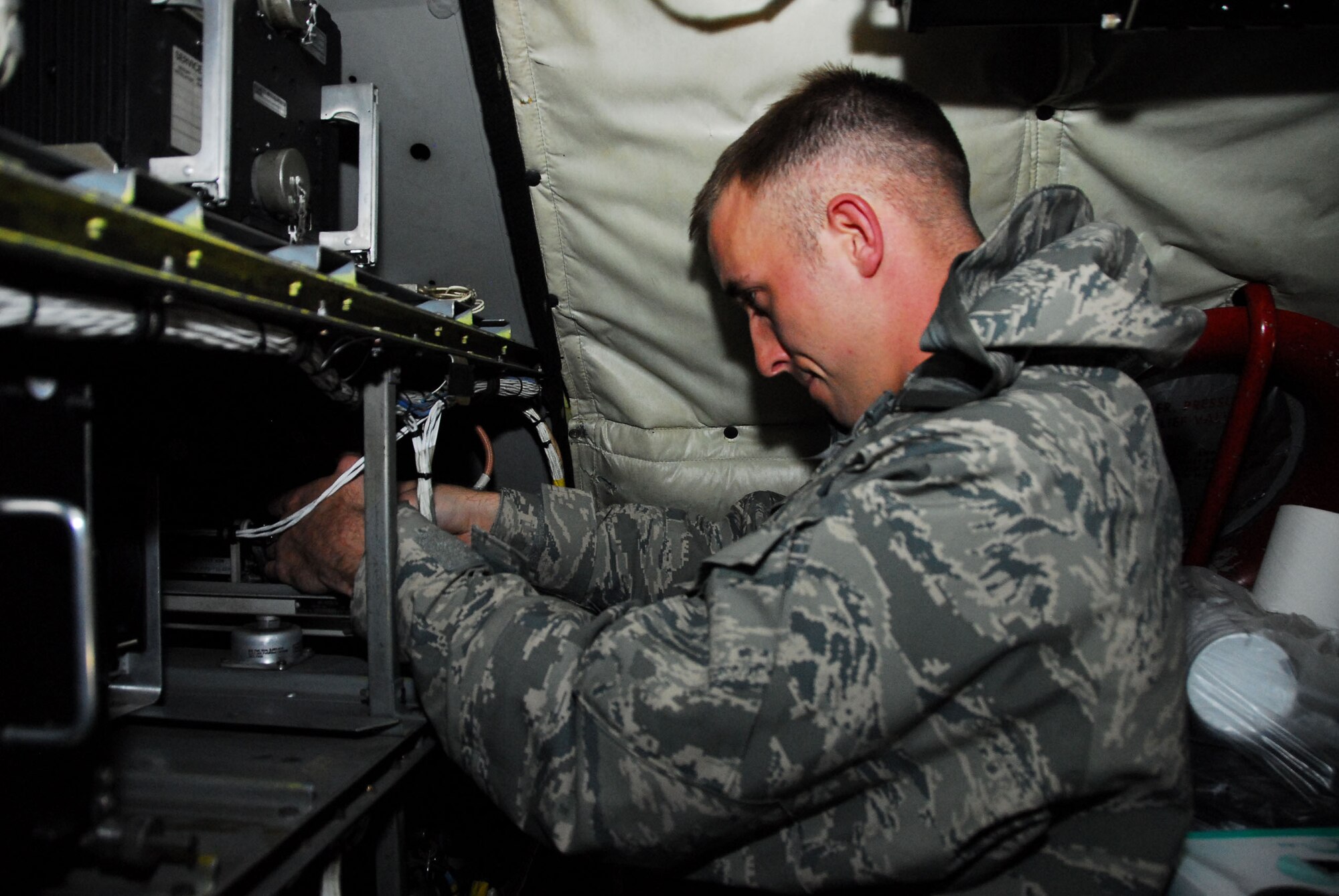 WESTERN EUROPE (March 30, 2011) -- Staff Sgt. Stephen Paluga, an avionics specialist deployed from the 161st Air Refueling Wing in Phoenix, repairs the navigation system of a KC-135 Stratotanker. The 313th now supports Operation Unified Protector, a NATO-led mission in Libya to protect civilians and civilian-populated areas under threat of attack. The 313th AEW provides aerial refueling to U.S. and coalition aircraft with KC-135 Stratotankers and KC-10 Extenders. (U.S. Air Force photo by Tech. Sgt. Stacy Gault)