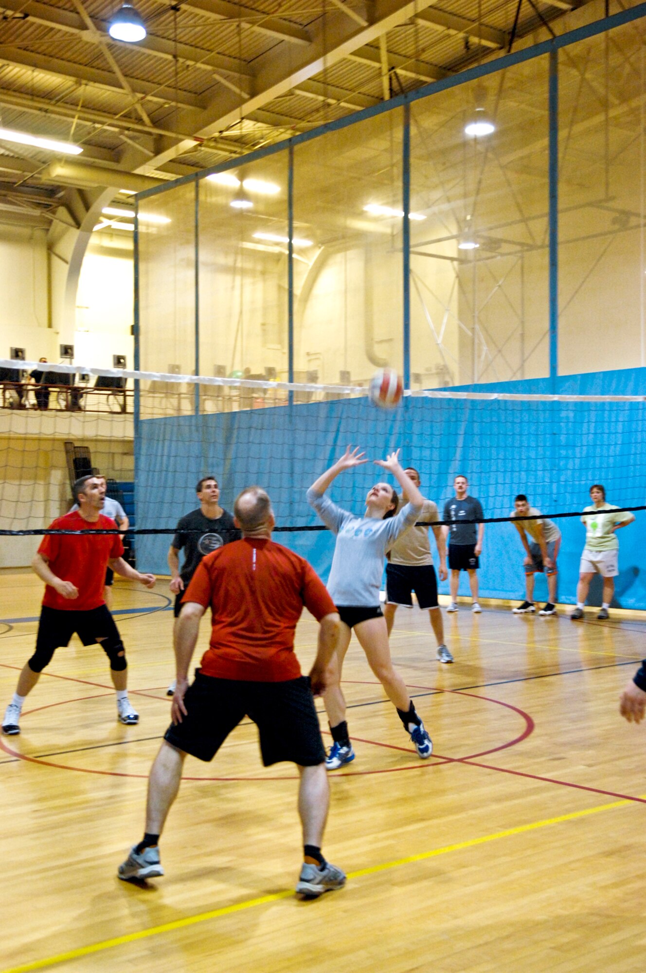 JOINT BASE ELMENDORF-RICHARDSON, Alaska --April Labrecque sets for a fellow U.S. Army Corps of Engineer team member to spike on the awaiting 517th Airlift Squadron team members. The USACE volleyball team won last years JBER volleyball tournament. (U.S. Air Force photo by Airman 1st Class Jack Sanders)