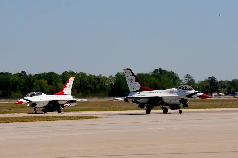 Two U.S. Air Force Thunderbird pilots taxi into their designated spots following a familiarization flight April 6, 2011, at Joint Base Charleston. The team's mission is to exhibit the capabilities of modern, warfighting aircraft and to demonstrate the high degree of skill maintained by Air Force members serving in a variety of career specialties. (U.S. Air Force photo/Airman 1st Class Ian Hoachlander)