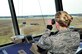 JOINT BASE MCGUIRE-DIX-LAKEHURST, N.J. -- Senior Airman Jessica Benjamin, 305th Operations Support Squadron air traffic controller, observes a KC-10 Extender land at Joint Base McGuire-Dix-Lakehurst April 6. As a member an air traffic controller, her job to control the airways over Joint Base McGuire-Dix-Lakehurst and the aircraft runways on McGuire. (U.S. Air Force photo by Wayne Russell/Released)