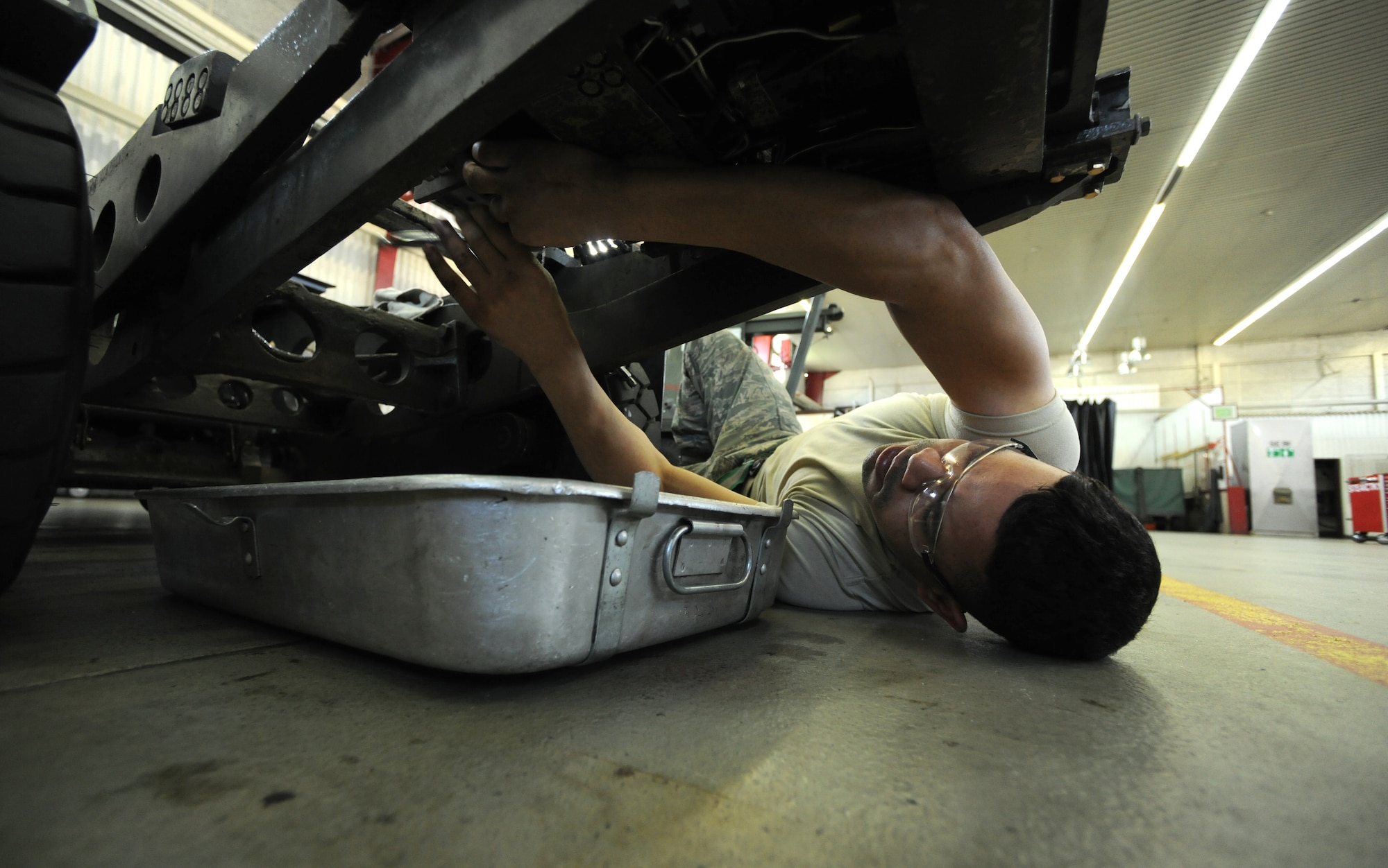 SPANGDAHLEM AIR BASE, Germany – Airman 1st Class Gary Hutchison, 52nd Equipment Maintenance Squadron aerospace ground equipment journeyman, removes bolts from a directional control valve on a MJ-1B bomb lift here April 7. The directional control valve controls the tilt and movement of the lift table enabling weapons loaders to make minuscule adjustments to munitions during the load process. Hydraulic lines power the valve, which then controls the tilt and horizontal movement of the load table. The driver can use the valve to fine-tune the position of the munitions. (U.S. Air Force photo/Senior Airman Nathanael Callon)