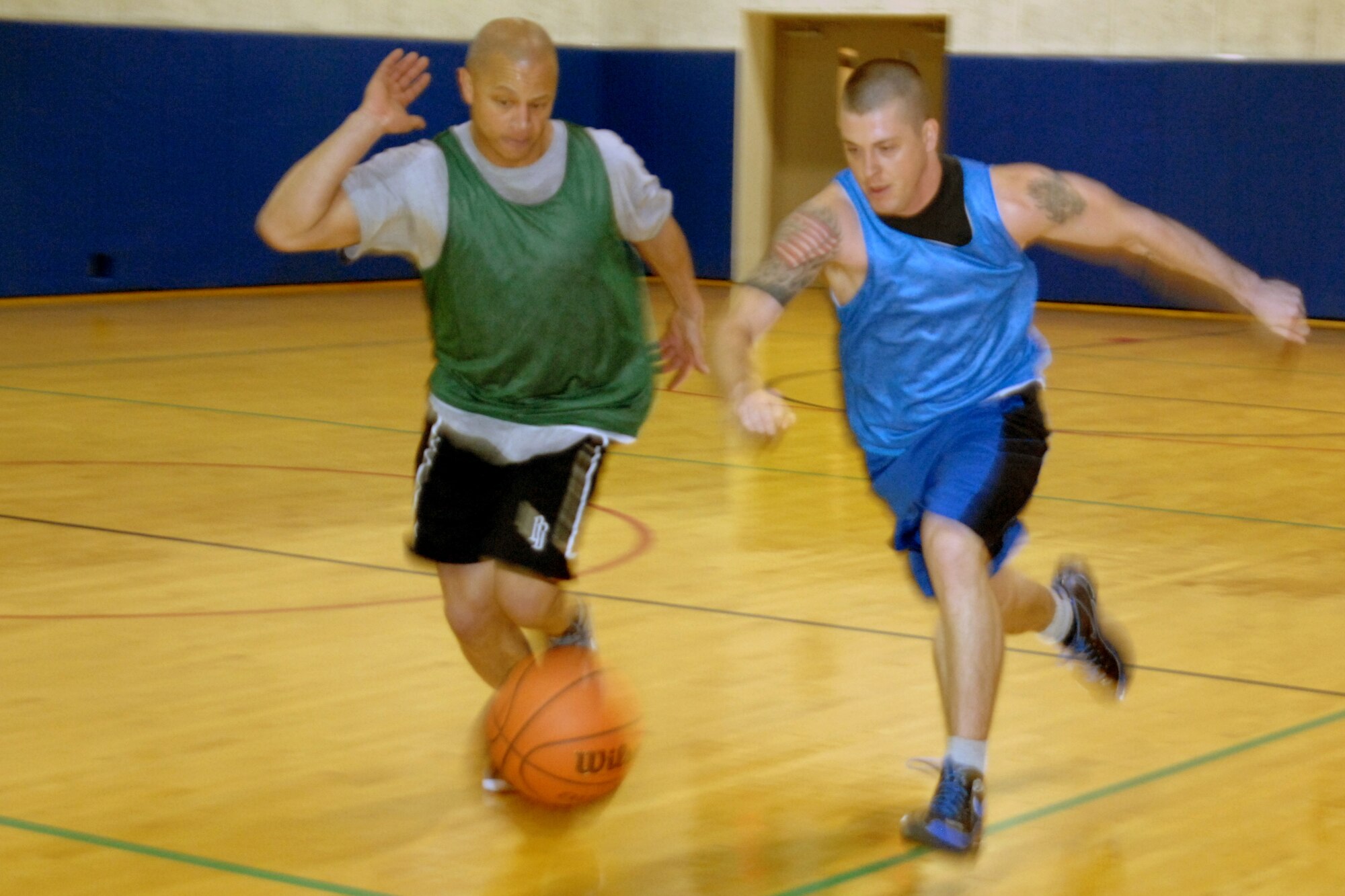 GRISSOM AIR RESERVE BASE, Ind.  -- Derek Bartee, 434th Seasoning Training Flight, right, is pressured by Ronnie Williams, Marines, and he tries to gather the ball on a fast break. Bartee and his teammates rallied from the loser's bracket to defeat the Marines 46-40 in the championship game of the annual double elimination tournament on April 2 (U.S. Air Force photo/Tech. Sgt. Douglas Hays)