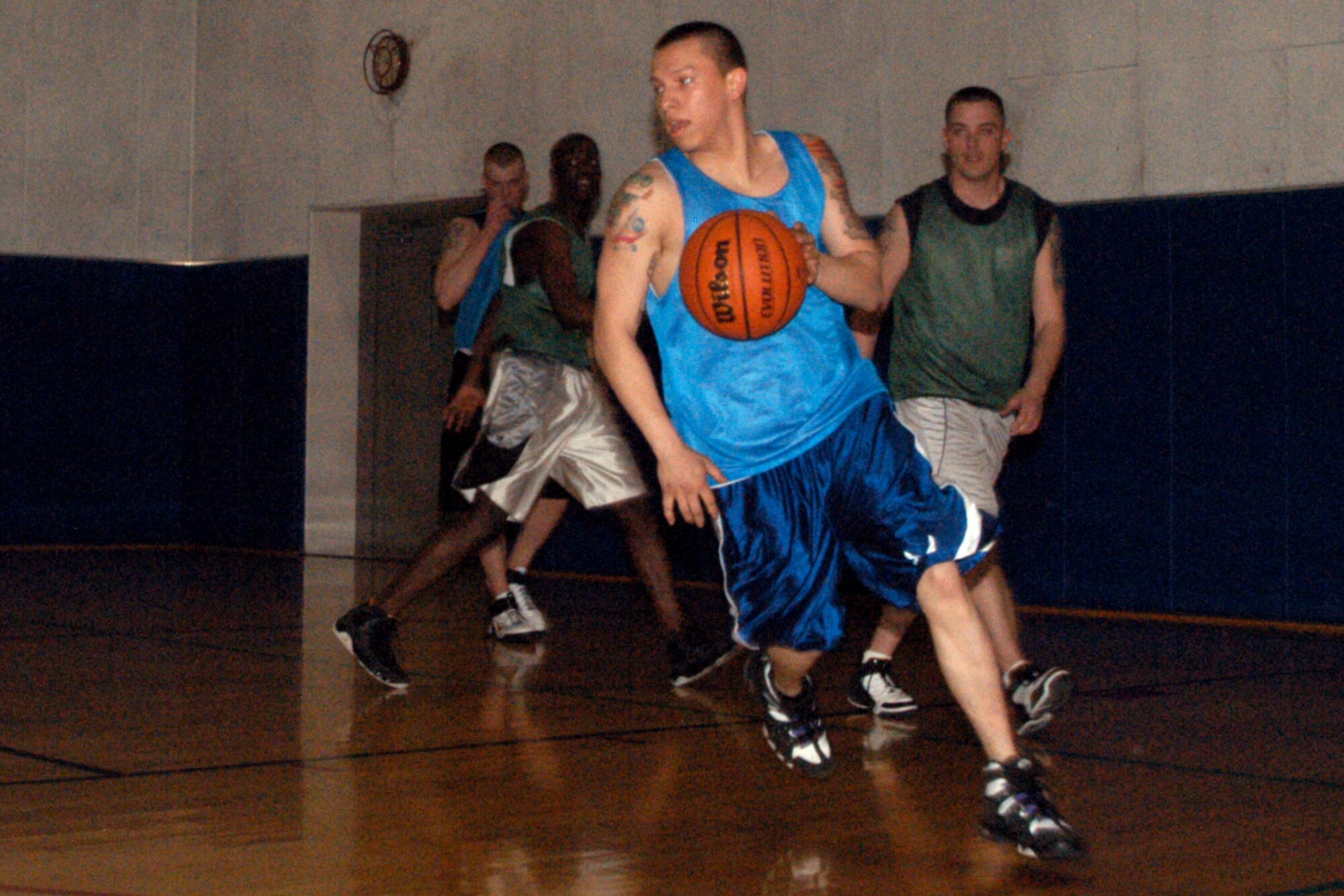 GRISSOM AIR RESERVE BASE, Ind. -- Michael Santiago, 434th Seasonal Training Flight, dribbles out of trouble during the closing seconds of the annual Grissom basketball championship game. The STF beat the Marines 46-40 to claim the hardwood crown April 2. (U.S. Air Force photo/Senior Airman Andrew McLaughlin)