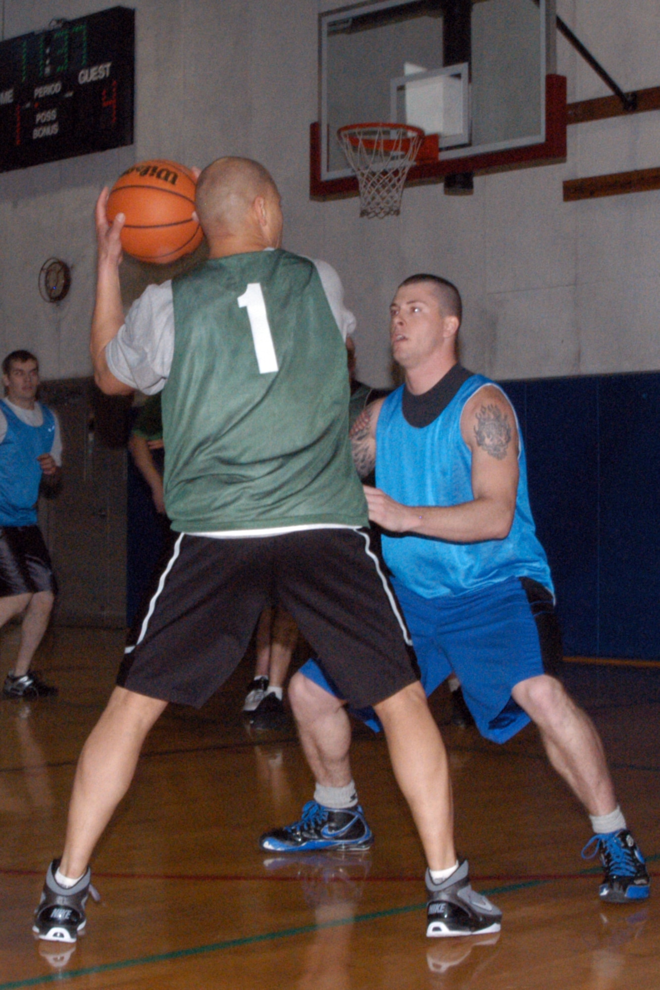 GRISSOM AIR RESERVE BASE, Ind.--  Derek Bartee, 434th Seasonal Training Flight, plays defense against Ronnie Williams, Marines, during the annual Grissom basketball championship game. (U.S. Air Force photo/Senior Airman Andrew McLaughlin)