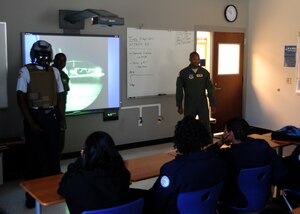 The Joint Base Charleston C-17 demonstration team explains the workings of the C-17 aircraft to Air Force JROTC students,  April 6, 2011 at Stall High School, S.C. The three-man team will demonstrate the capabilities of the C-17 during the 2011 Air Expo on Joint Base Charleston, April 9, 2011. (U.S. Air Force photo/Senior Airman Timothy Taylor)
