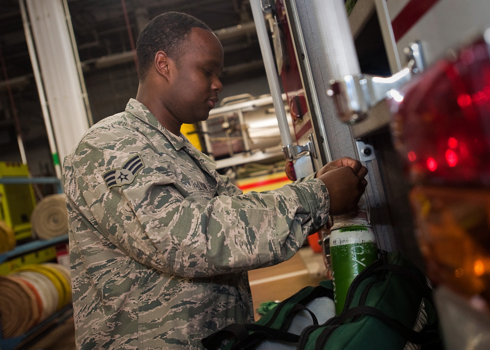 YOKOTA AIR BASE, Japan -- YOKOTA AIR BASE, Japan -- Senior Airman Stanley Lynn, 374th Civil Engineer Squadron firefighter, inspects fire truck equipment here April 7, 2011. The fire engines and the equipment on them must be inspected before the start of every shift to ensure they will function when an incident occurs. In support of Operation Tomodachi, firefighters continually train and maintain mission readiness.  (U.S. Air Force photo/Airman 1st Class Andrea Salazar)