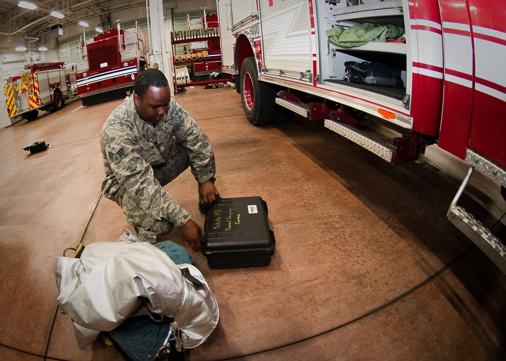 YOKOTA AIR BASE, Japan -- Senior Airman Stanley Lynn, 374th Civil Engineer Squadron firefighter, inspects fire truck equipment here April 7, 2011. The fire engines and the equipment on them must be inspected before the start of every shift to ensure they will function when an incident occurs. (U.S. Air Force photo/Airman 1st Class Andrea Salazar)