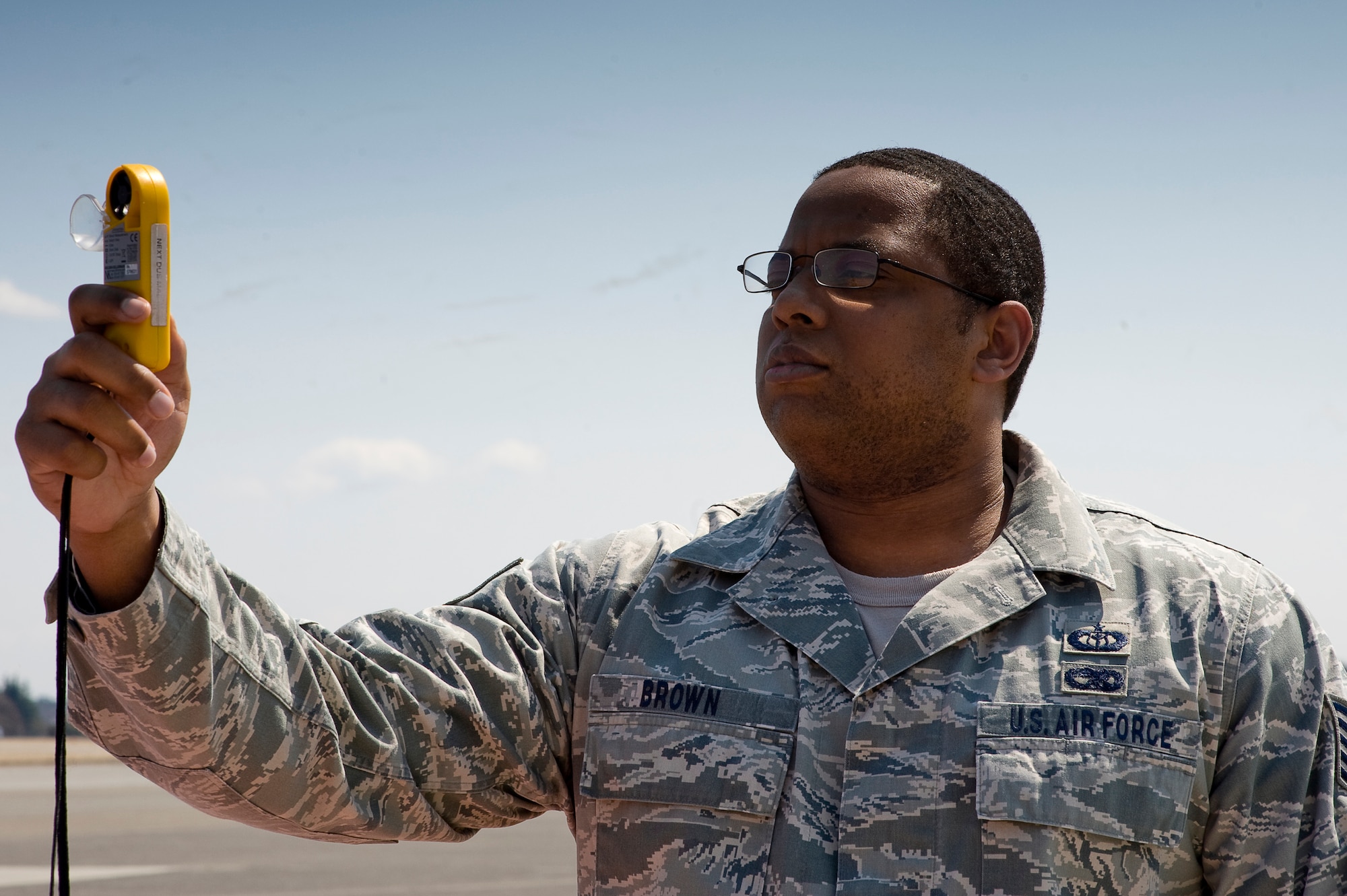 YOKOTA AIR BASE, Japan -- Tech. Sgt. Nicky Brown, 374th Operations Squadron, checks the current weather using a Kestrel 4500 at Yokota, March 28. The Mission Weather Element is responsible for weather briefings for Yokota to Sendai Airport supporting all missions flying relief supplies for Operation Tomodachi.  (U.S. Air Force photo/Master Sgt. Jeromy K. Cross)






