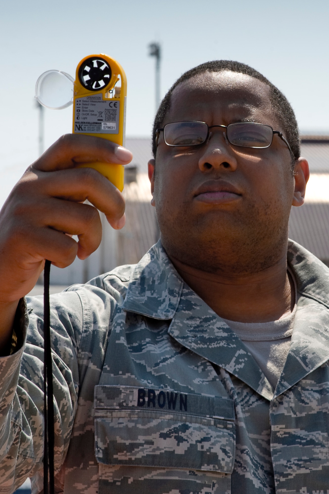 YOKOTA AIR BASE, Japan -- Tech. Sgt. Nicky Brown, 374th Operations Squadron, checks the current weather using a Kestrel 4500 at Yokota, March 28. The Mission Weather Element is responsible for weather briefings for Yokota to Sendai Airport supporting all missions flying relief supplies for Operation Tomodachi.  (U.S. Air Force photo/Master Sgt. Jeromy K. Cross)







